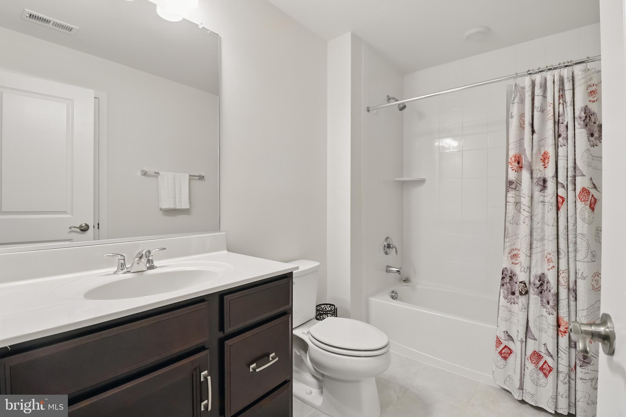 1010 Coubertin Drive Southeast Leesburg, VA 20175 - Photo 41 of 44 a bathroom with a sink a toilet and shower