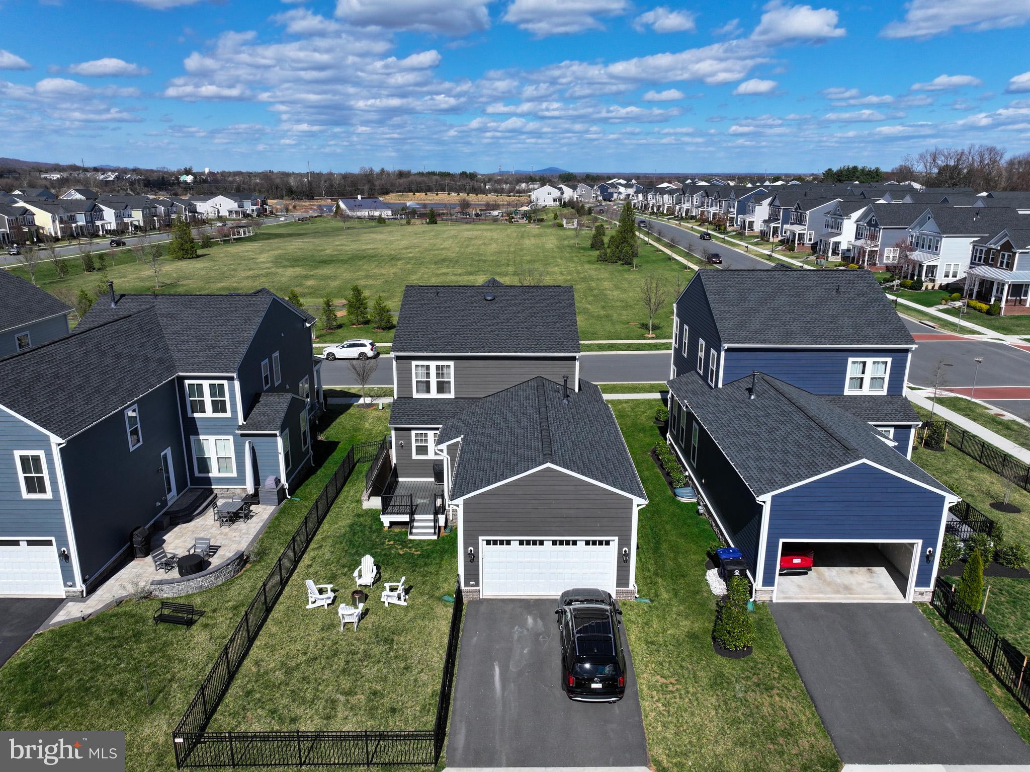 1010 Coubertin Drive Southeast Leesburg, VA 20175 - Photo 43 of 44 an aerial view of a house with a garden and lake view