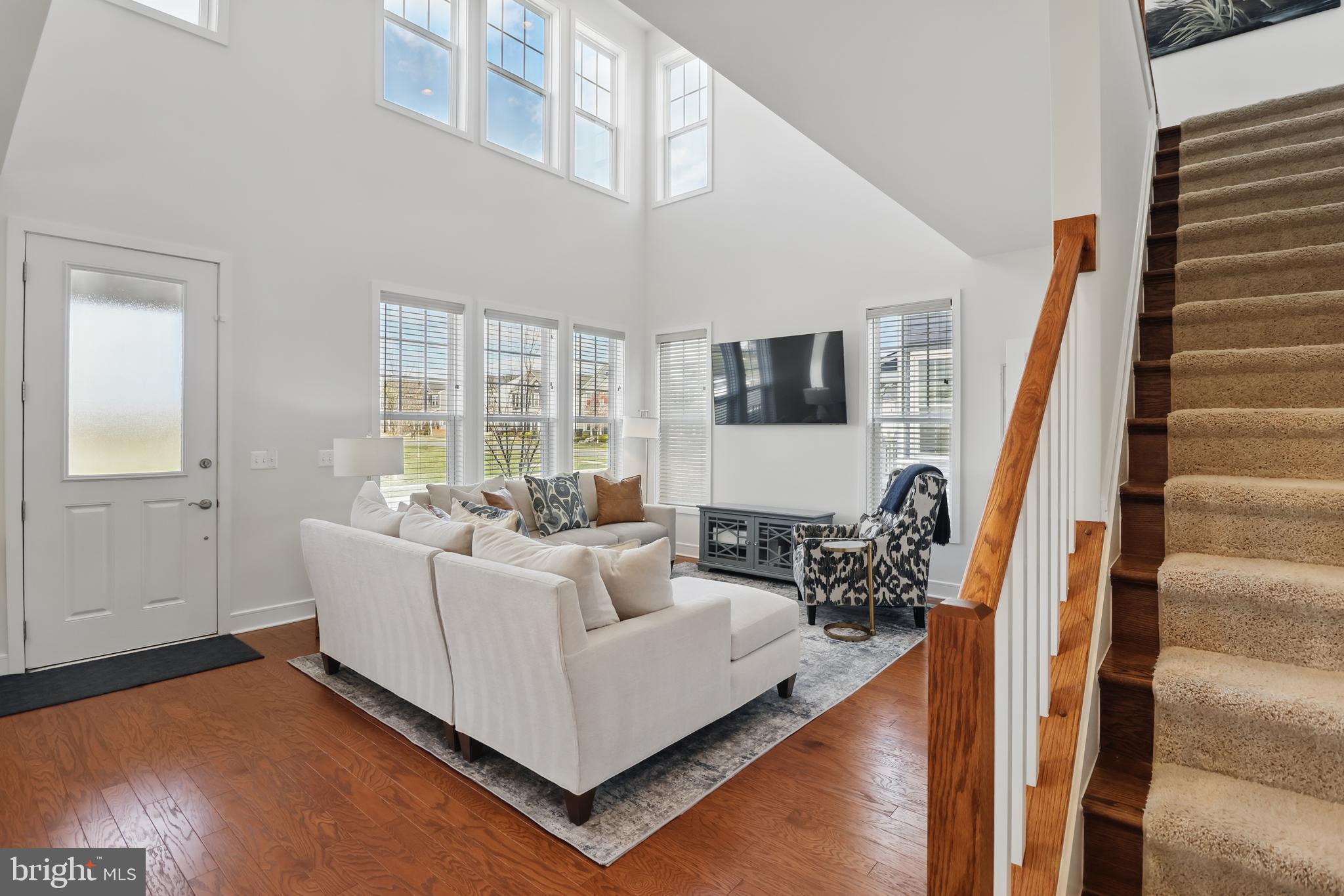1010 Coubertin Drive Southeast Leesburg, VA 20175 - Photo 8 of 44 a living room with furniture and a large window