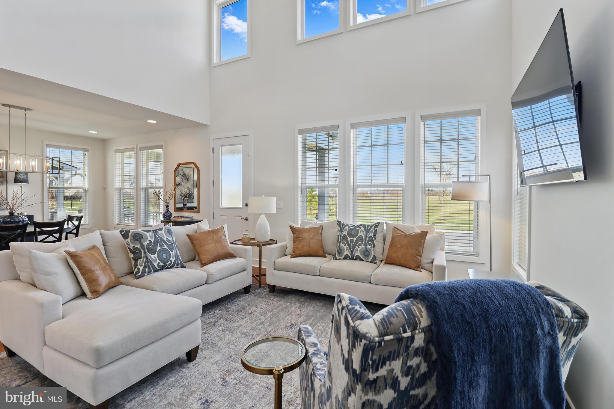 1010 Coubertin Drive Southeast Leesburg, VA 20175 - Photo 10 of 44 a living room with furniture and a large window