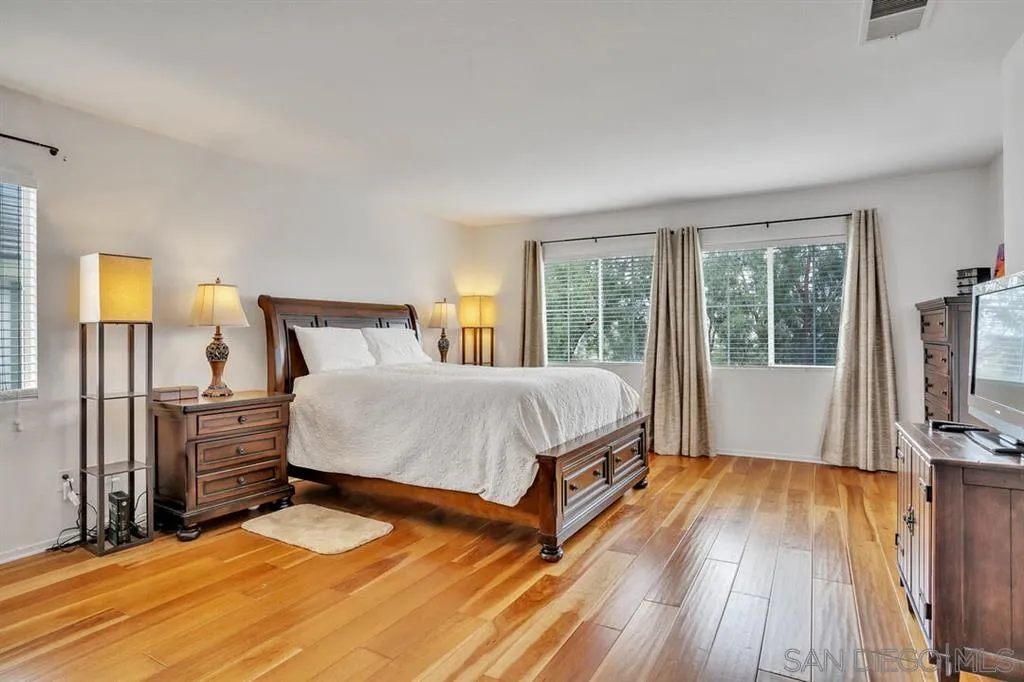 1103 Greenway Road Oceanside, CA 92057 - Photo 11 of 25 a bed sitting in a spacious bedroom next to a window