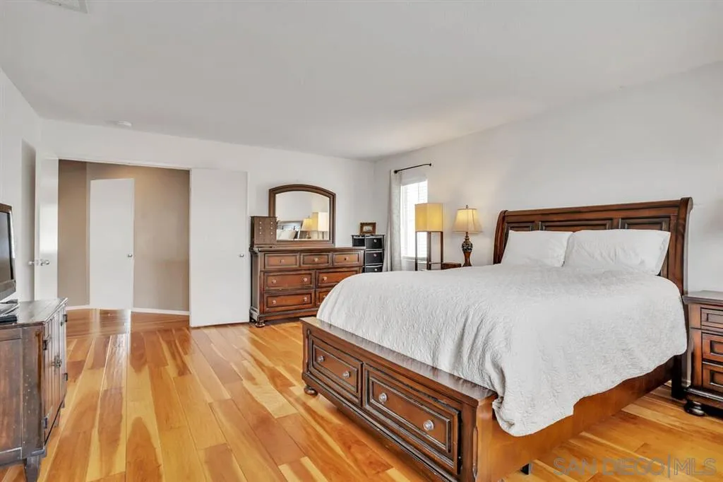 1103 Greenway Road Oceanside, CA 92057 - Photo 12 of 25 a bedroom with a bed and a dresser