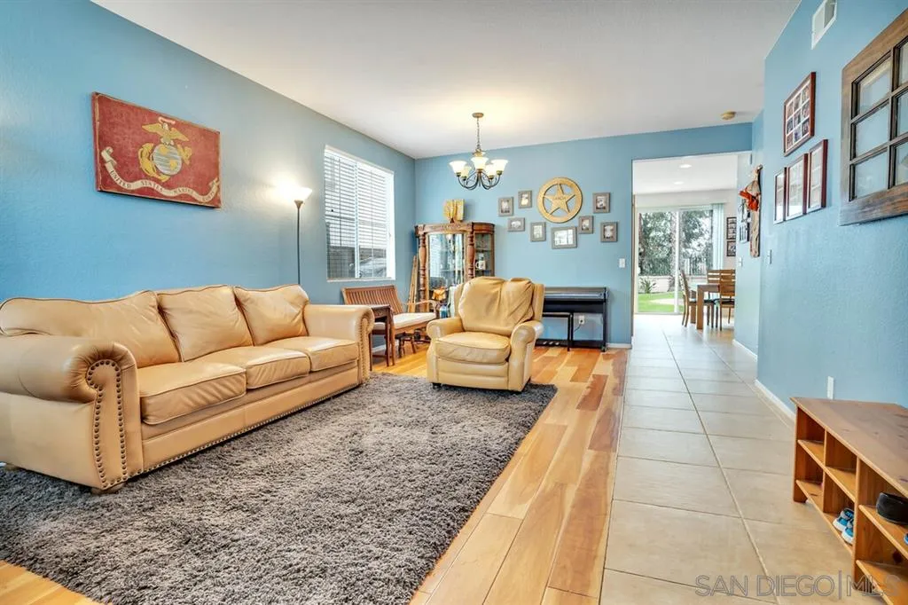 1103 Greenway Road Oceanside, CA 92057 - Photo 3 of 25 a living room with furniture and a table