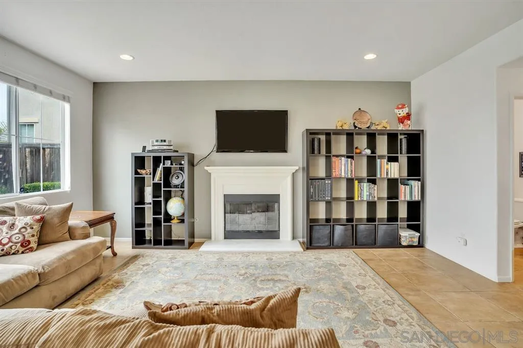 1103 Greenway Road Oceanside, CA 92057 - Photo 9 of 25 a living room with furniture and a flat screen tv