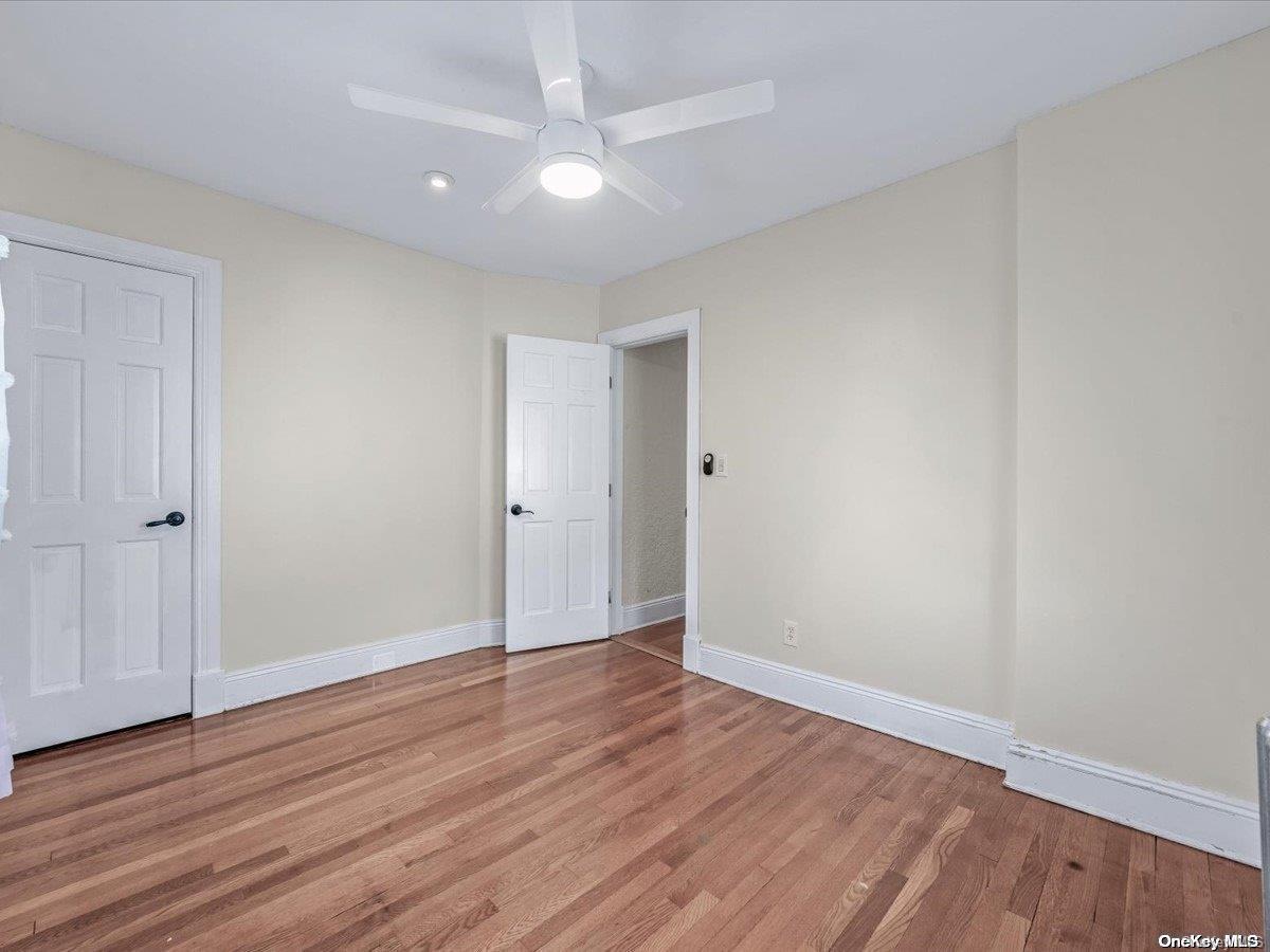 33-71 161st Street Queens, NY 11358 - Photo 20 of 35 a view of an empty room with wooden floor