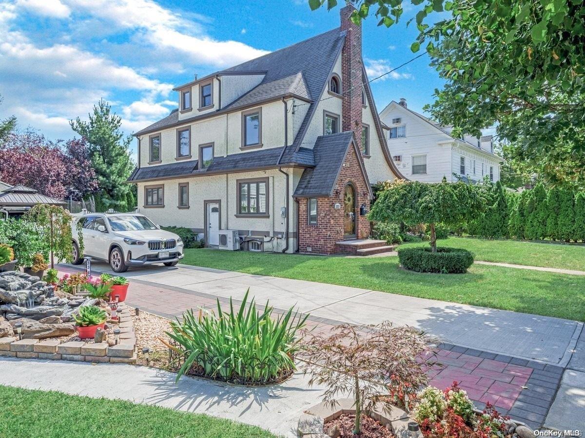 33-71 161st Street Queens, NY 11358 - Photo 35 of 35 a front view of a house with a garden and pathway