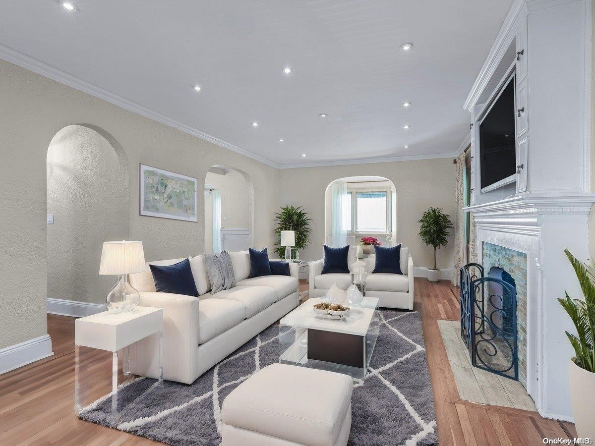 33-71 161st Street Queens, NY 11358 - Photo 4 of 35 a living room with furniture fireplace and rug