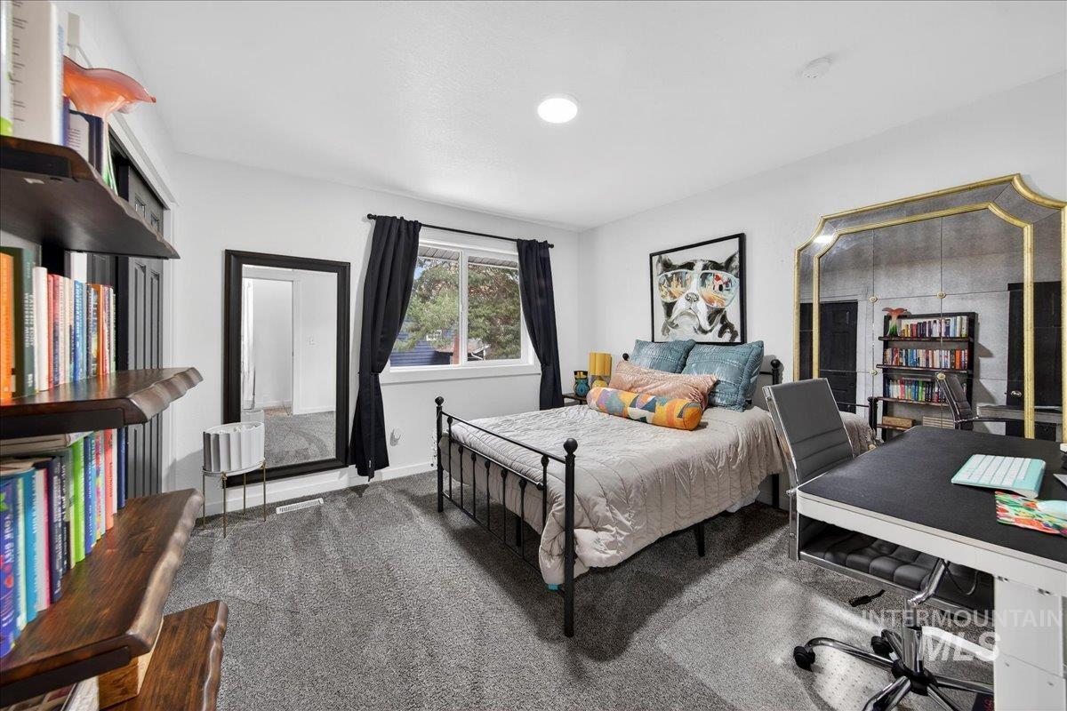 760 Meaghan Place Boise, ID 83712 - Photo 20 of 38 Carpeted bedroom featuring a desk and baseboards