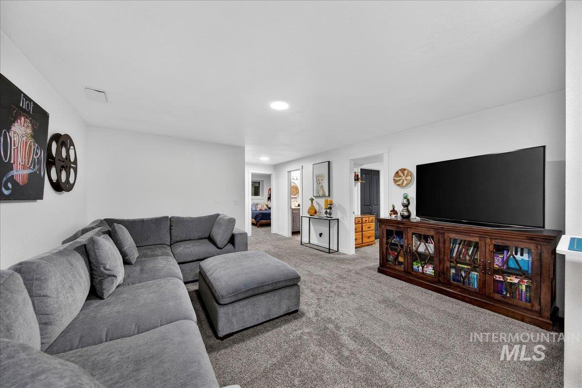 760 Meaghan Place Boise, ID 83712 - Photo 32 of 38 Living room featuring carpet flooring and recessed lighting