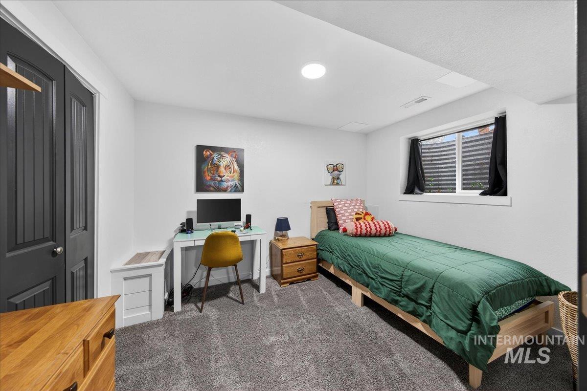 760 Meaghan Place Boise, ID 83712 - Photo 33 of 38 Bedroom featuring dark carpet and an office area