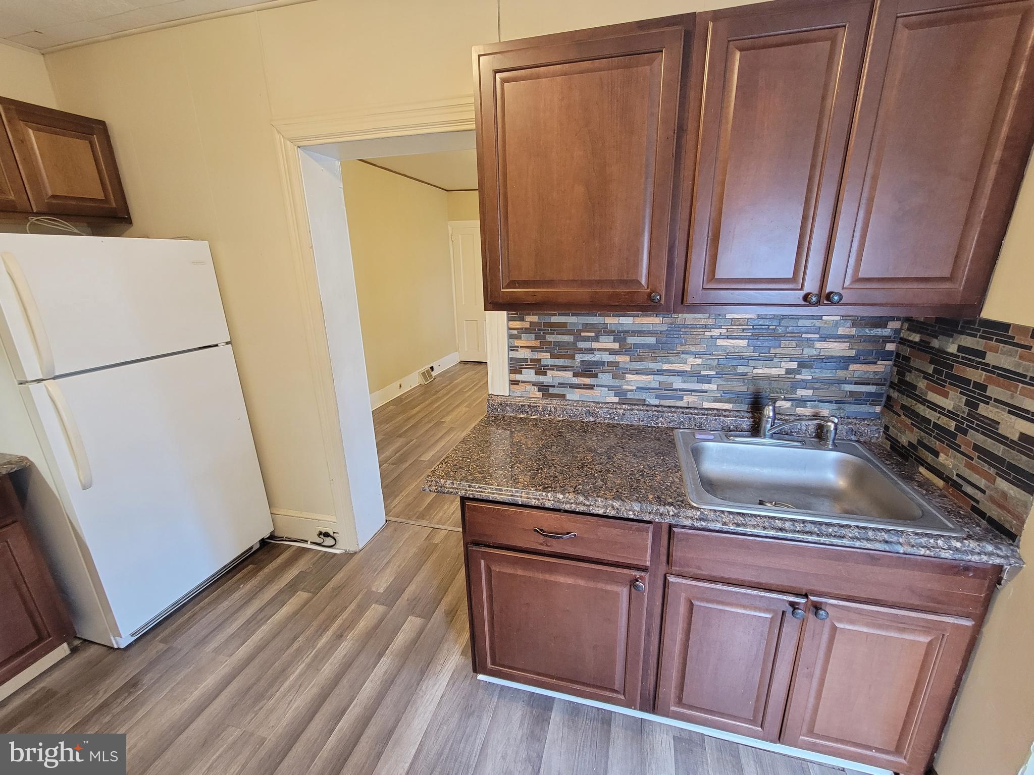 923 Walnut Street, Unit 1 Royersford, PA 19468 - Photo 12 of 14 a kitchen with granite countertop cabinets and sink