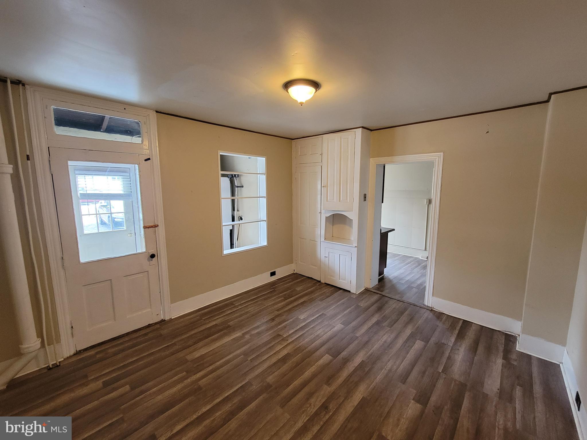 923 Walnut Street, Unit 1 Royersford, PA 19468 - Photo 3 of 14 a view of empty room with wooden floor and entryway