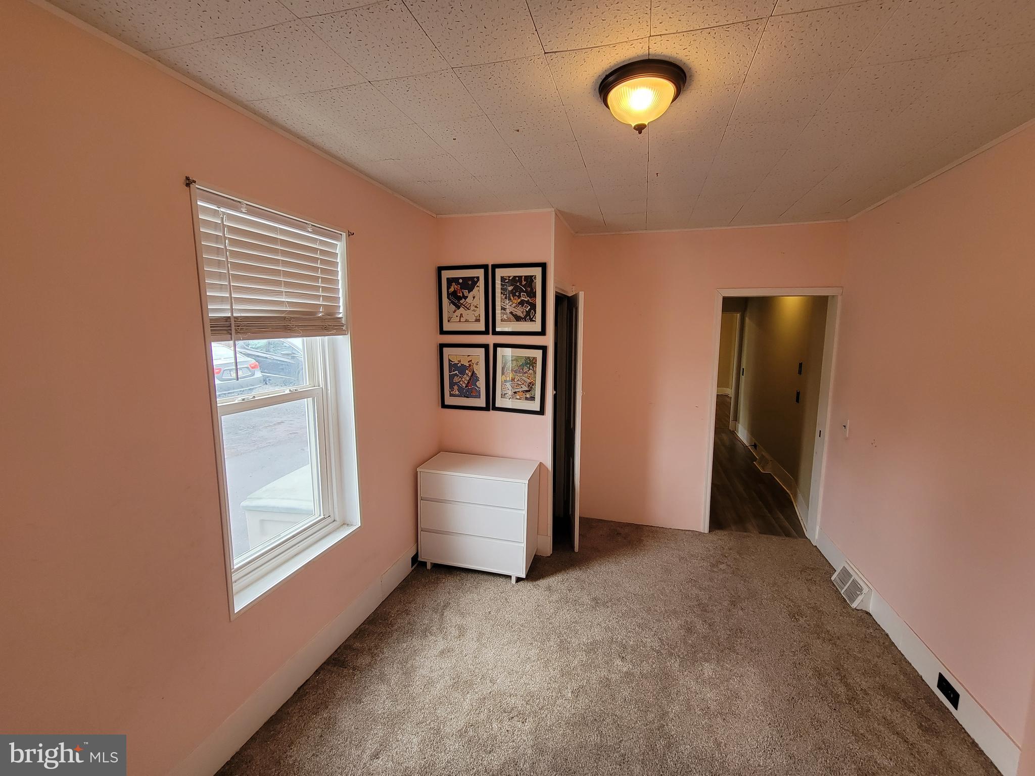 923 Walnut Street, Unit 1 Royersford, PA 19468 - Photo 7 of 14 a view of an empty room with window and cabinet