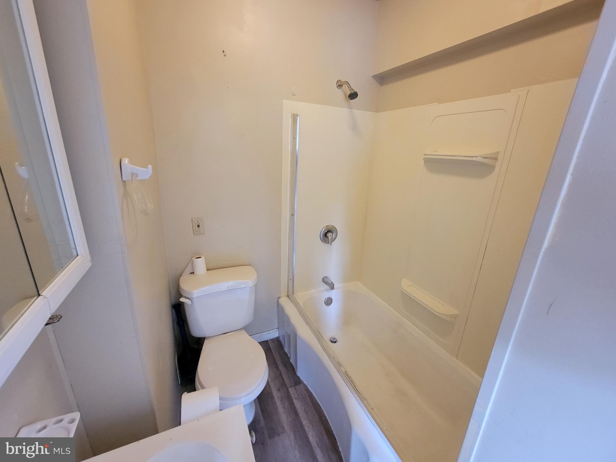 923 Walnut Street, Unit 1 Royersford, PA 19468 - Photo 10 of 14 a white toilet sitting next to a bath tub