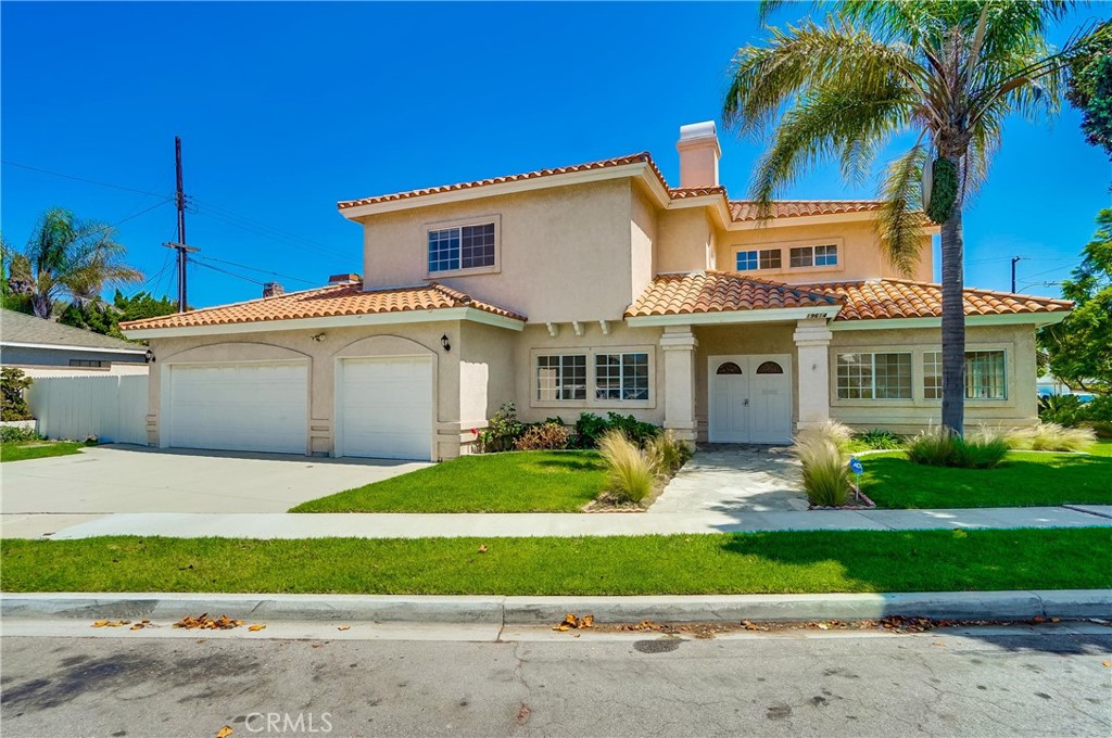 19614 Darien Place Torrance, CA 90503 - Photo 1 of 72 a view of a white house with a yard and plants next to a road