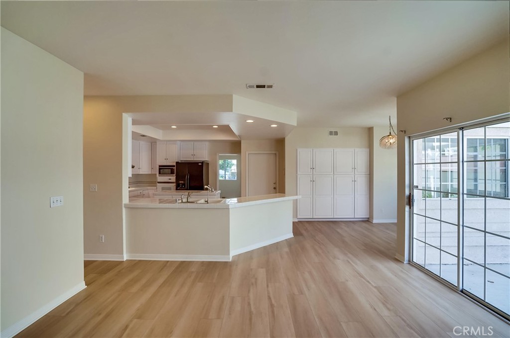 19614 Darien Place Torrance, CA 90503 - Photo 16 of 72 a view of a kitchen with wooden floor and a window