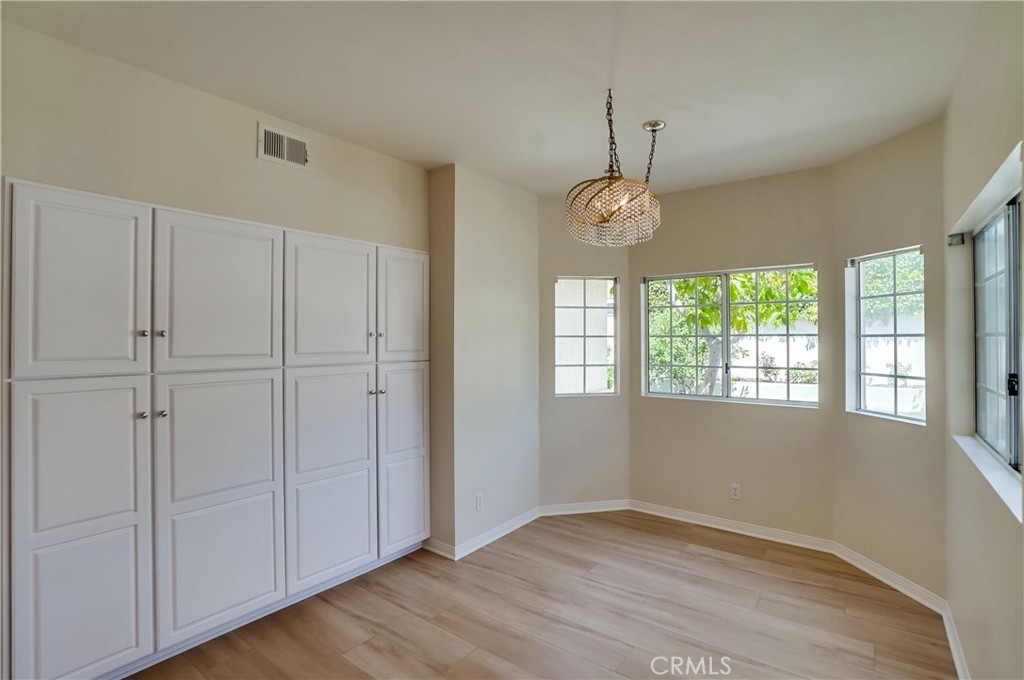 19614 Darien Place Torrance, CA 90503 - Photo 18 of 72 a view of an empty room with a window and wooden floor