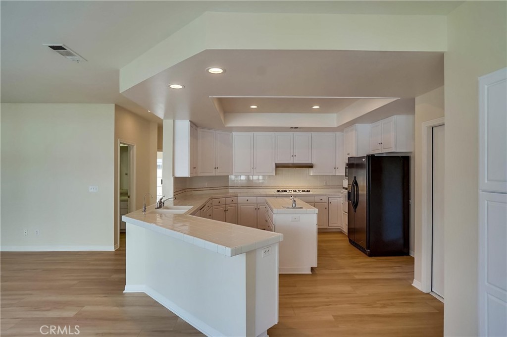 19614 Darien Place Torrance, CA 90503 - Photo 21 of 72 a kitchen with stainless steel appliances granite countertop a refrigerator a sink and a stove