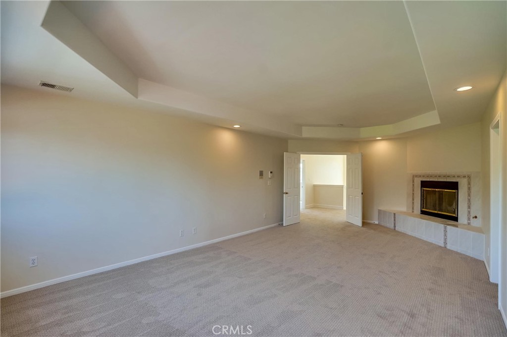19614 Darien Place Torrance, CA 90503 - Photo 31 of 72 a view of an empty room with a fireplace and a window