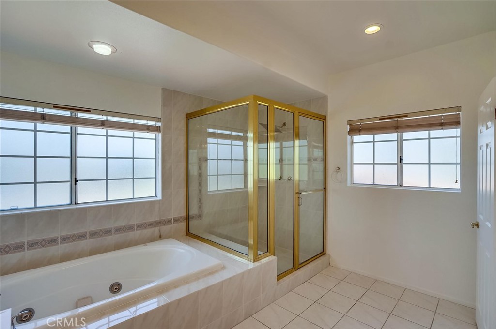 19614 Darien Place Torrance, CA 90503 - Photo 34 of 72 a bathroom with a shower and a bathtub