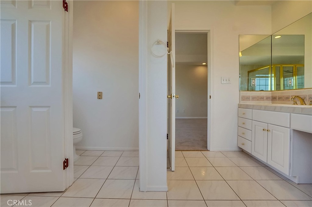 19614 Darien Place Torrance, CA 90503 - Photo 37 of 72 a bathroom with a sink a toilet and shower