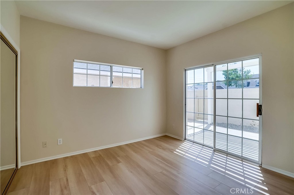 19614 Darien Place Torrance, CA 90503 - Photo 53 of 72 an empty room with wooden floor and windows