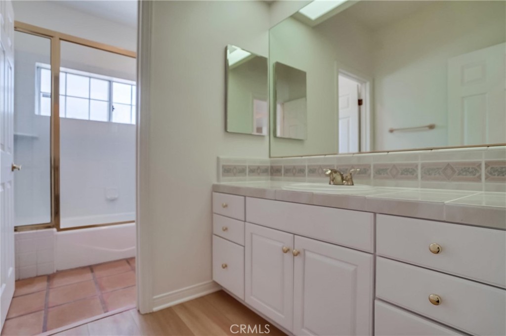 19614 Darien Place Torrance, CA 90503 - Photo 56 of 72 a bathroom with a sink and a mirror