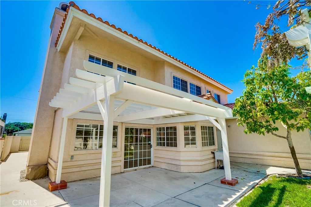 19614 Darien Place Torrance, CA 90503 - Photo 65 of 72 a front view of a house with a yard