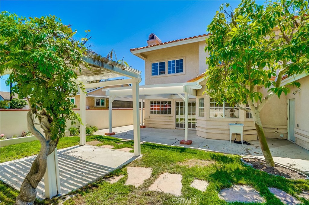 19614 Darien Place Torrance, CA 90503 - Photo 67 of 72 a front view of a house with a yard