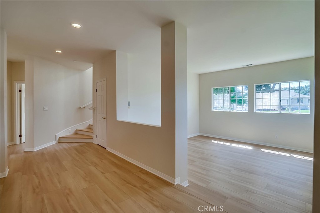19614 Darien Place Torrance, CA 90503 - Photo 7 of 72 an empty room with wooden floor and windows