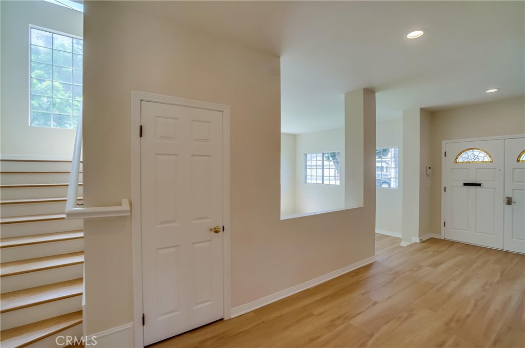 19614 Darien Place Torrance, CA 90503 - Photo 9 of 72 a view of an empty room with wooden floor and a window