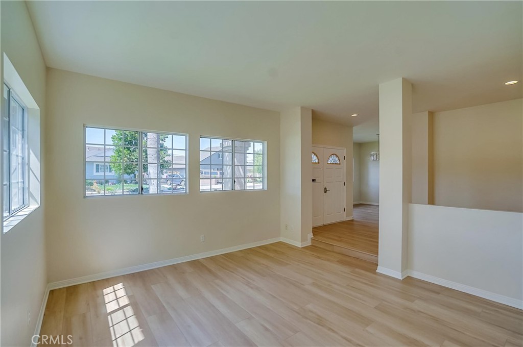 19614 Darien Place Torrance, CA 90503 - Photo 10 of 72 an empty room with wooden floor and windows
