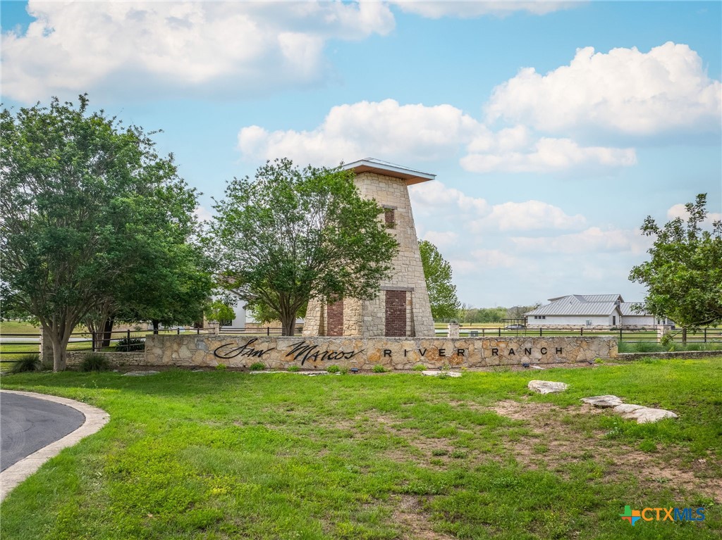 114 River Ranch Circle Martindale, TX 78655 - Photo 2 of 17 a front view of a house with garden