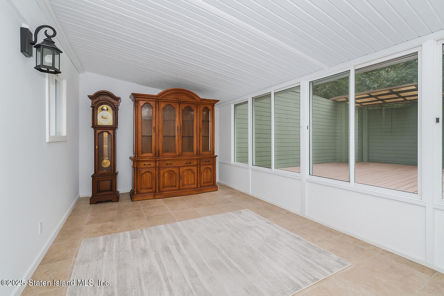 18 Atmore Place Staten Island, NY 10306 - Photo 13 of 19 a view of a livingroom with wooden floor and furniture