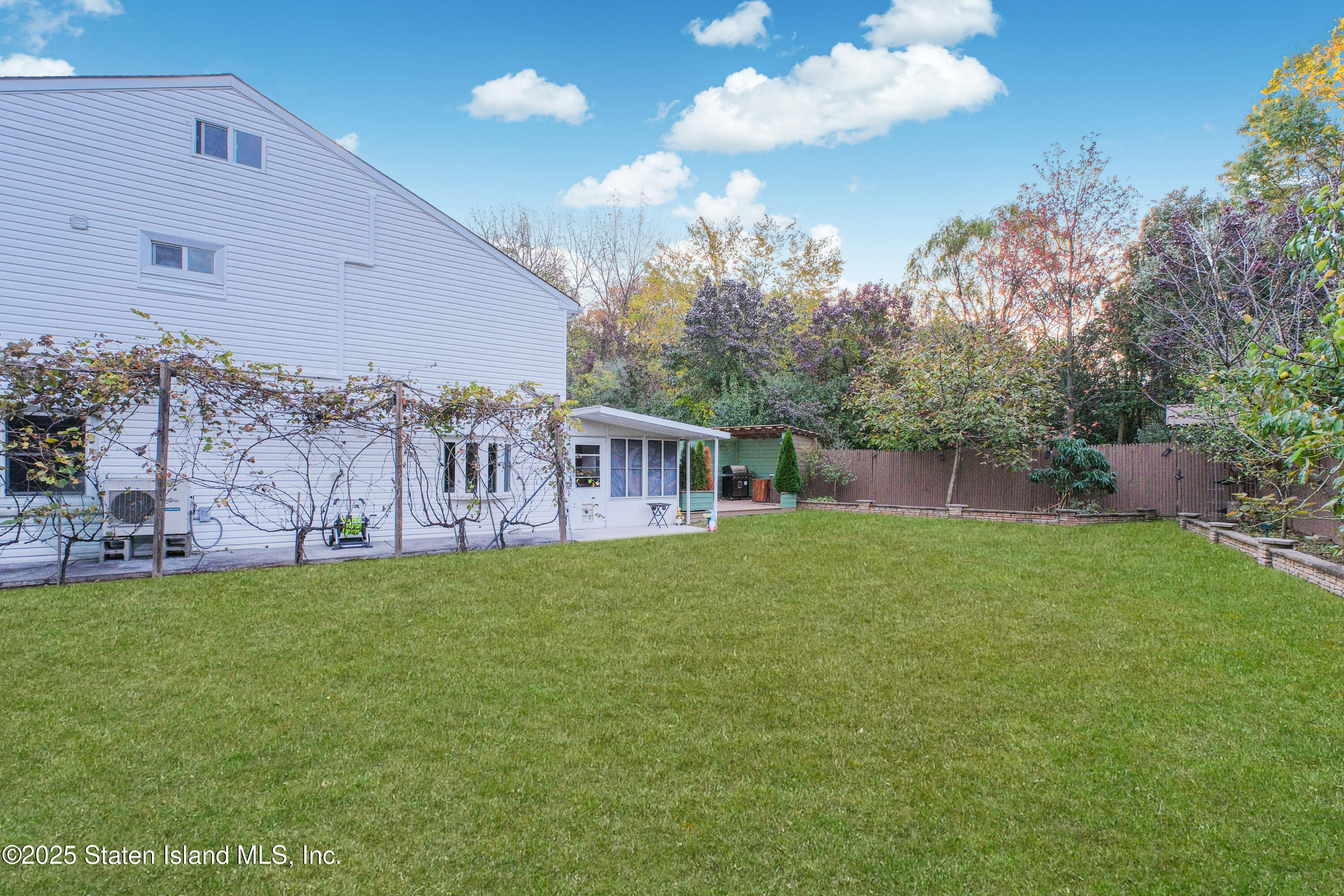 18 Atmore Place Staten Island, NY 10306 - Photo 14 of 19 a view of a house with a yard
