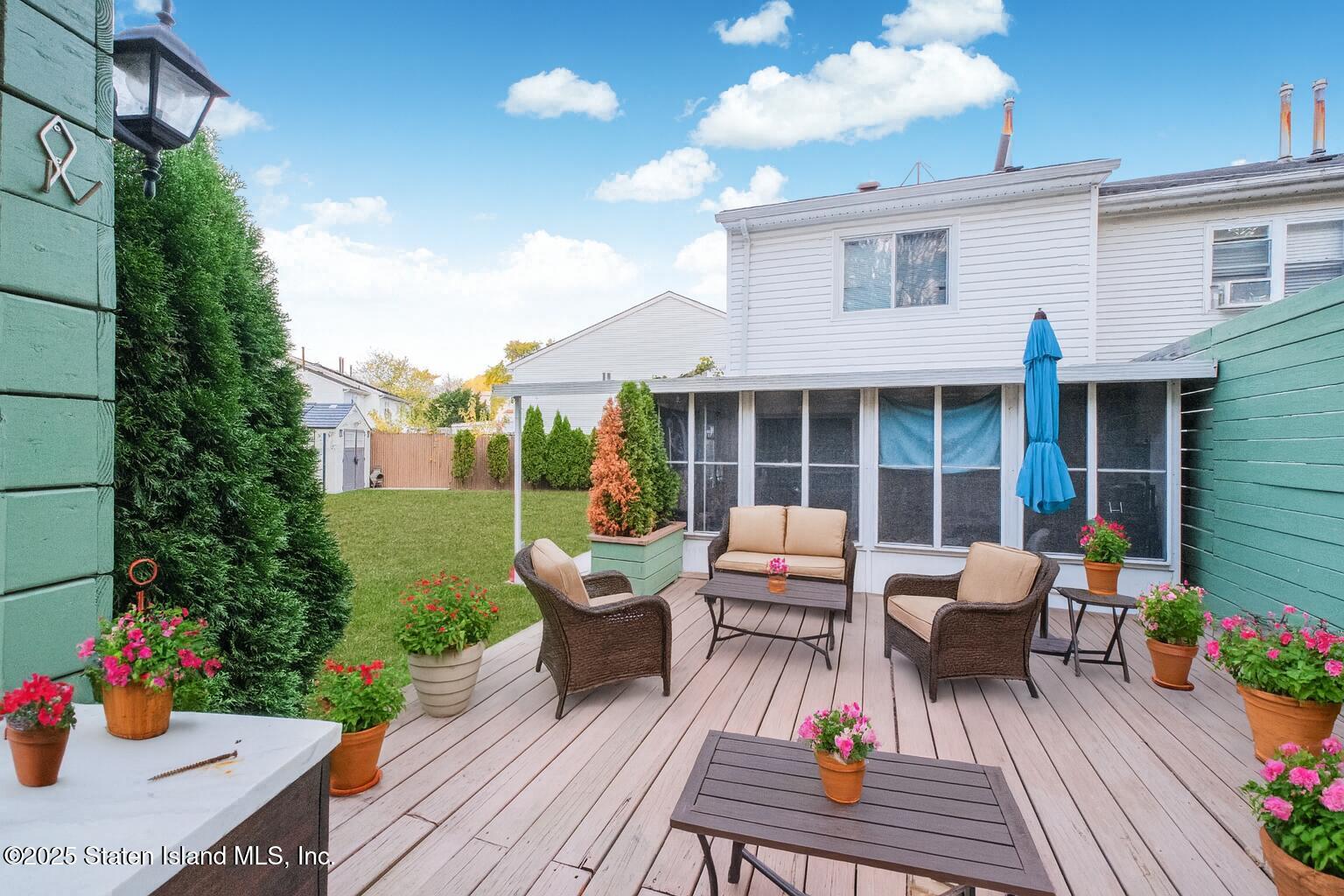 18 Atmore Place Staten Island, NY 10306 - Photo 16 of 19 a view of a patio with couches and potted plants