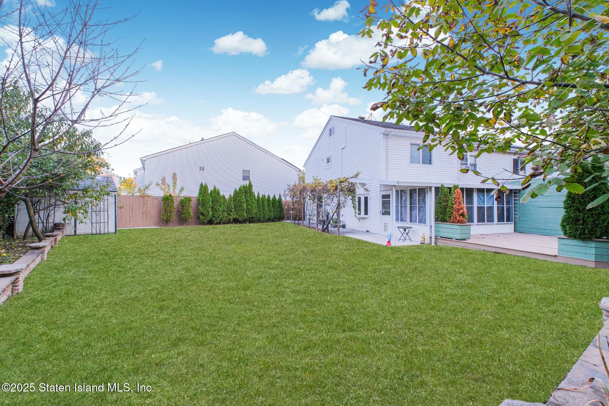 18 Atmore Place Staten Island, NY 10306 - Photo 17 of 19 a view of house with outdoor space and garden