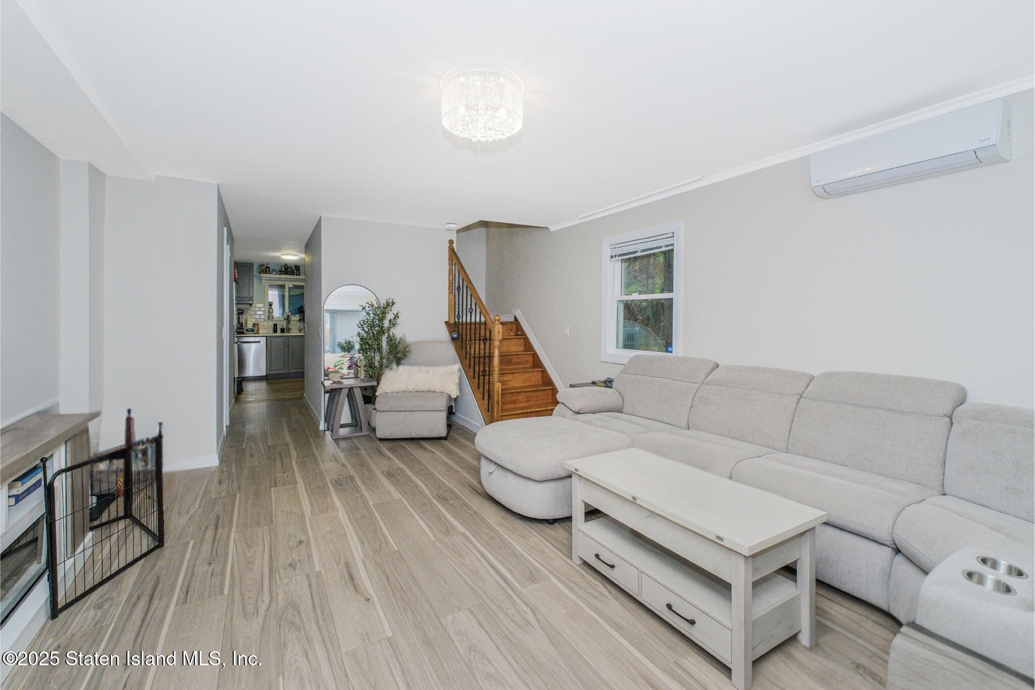 18 Atmore Place Staten Island, NY 10306 - Photo 3 of 19 a living room with furniture and a wooden floor