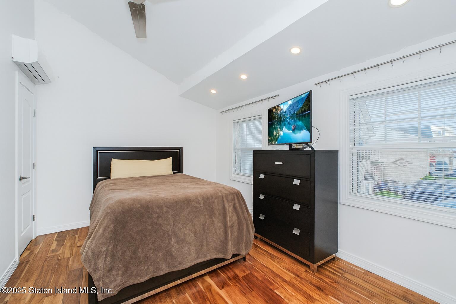 18 Atmore Place Staten Island, NY 10306 - Photo 8 of 19 a bedroom with a bed and a window