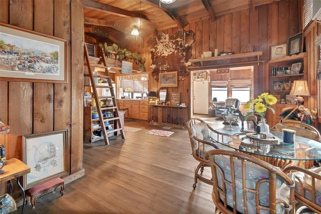 a dining room with furniture and chandelier