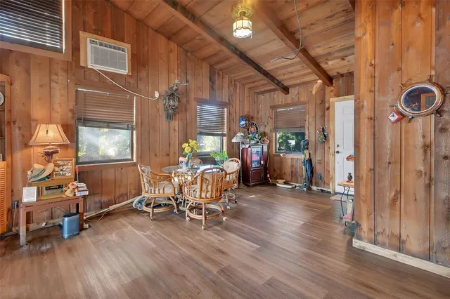 a bedroom with furniture and a window
