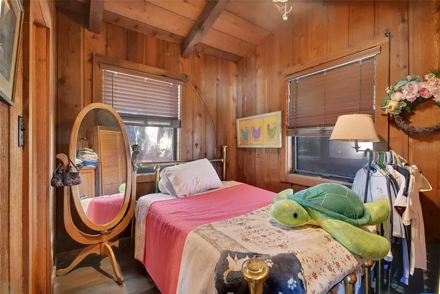 a bedroom with a bed and a bathroom