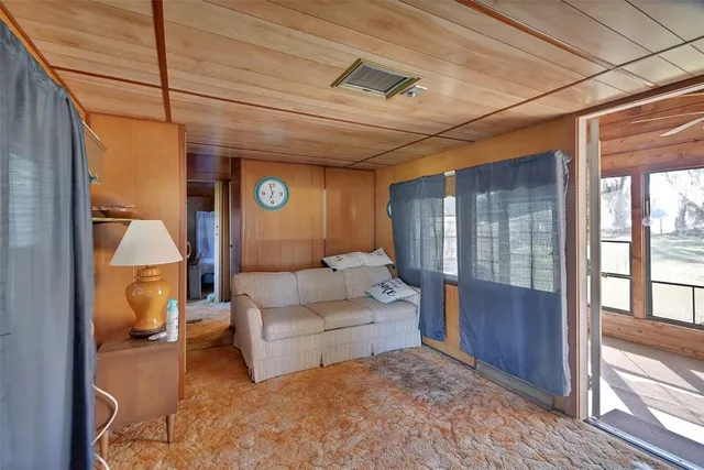 a living room with furniture and a gate