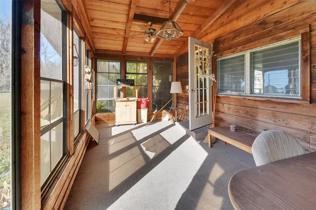 a balcony with chairs and outdoor view