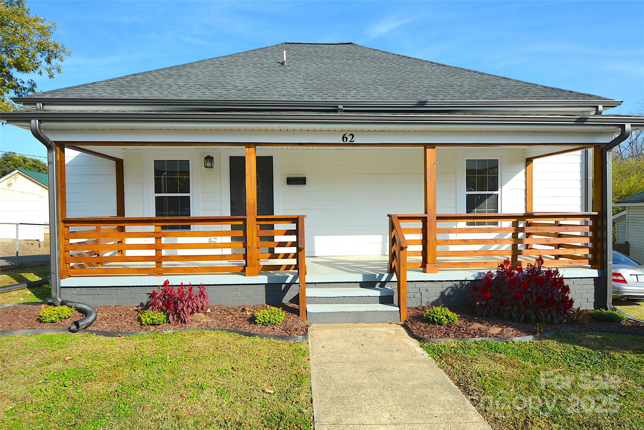 62 Fourth Street Cramerton, NC 28032 - Photo 1 of 26 front view of a house with a big yard