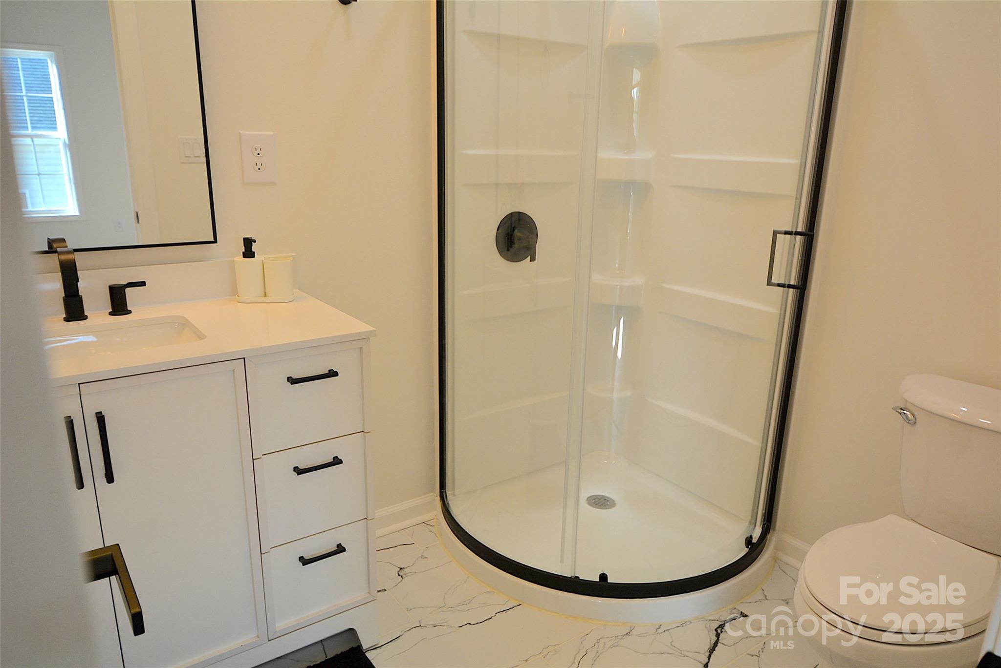 62 Fourth Street Cramerton, NC 28032 - Photo 20 of 26 a bathroom with a sink toilet and shower