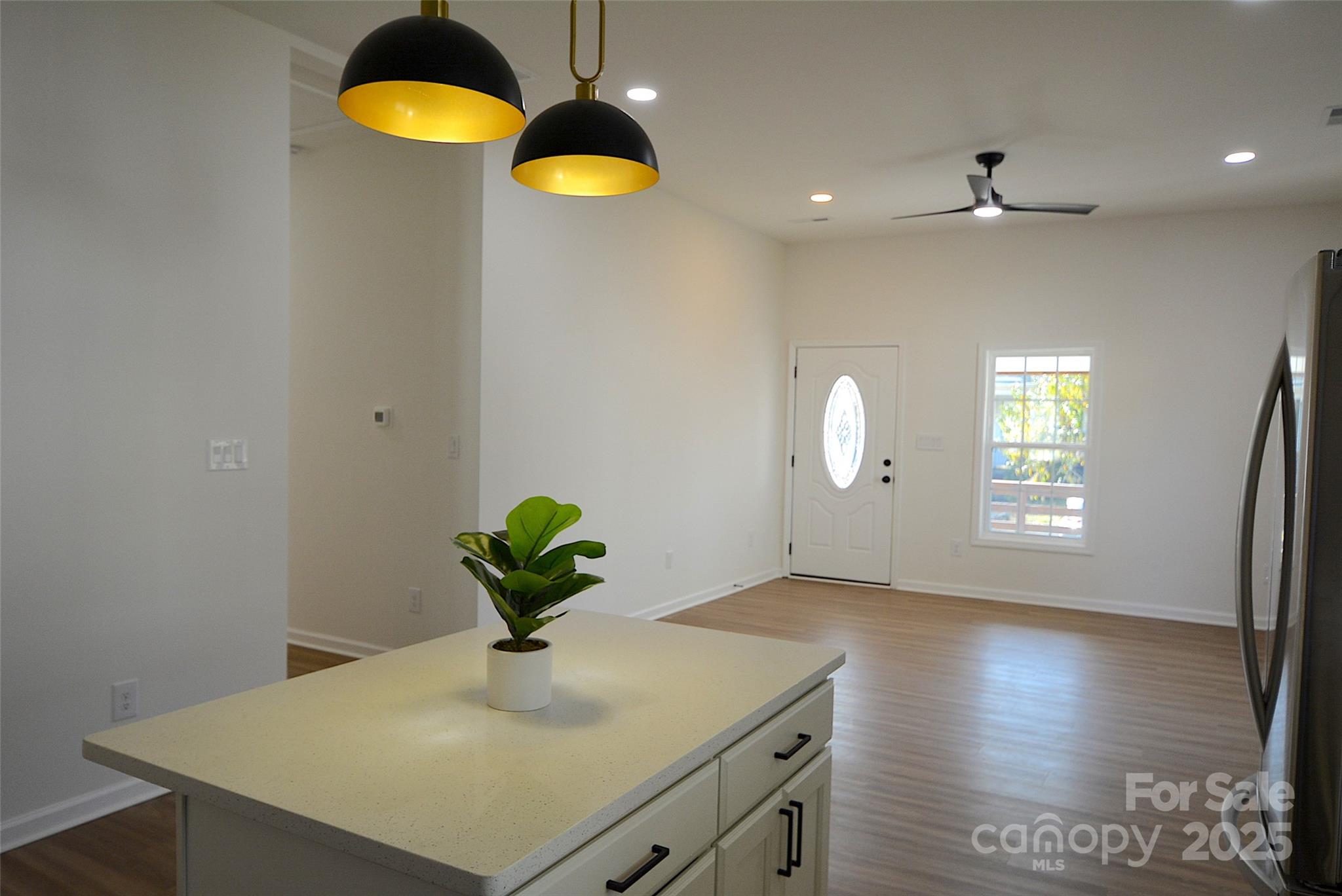 62 Fourth Street Cramerton, NC 28032 - Photo 9 of 26 a view of a kitchen with a sink and a chandelier