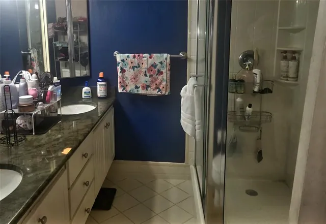 a bathroom with a sink and mirror