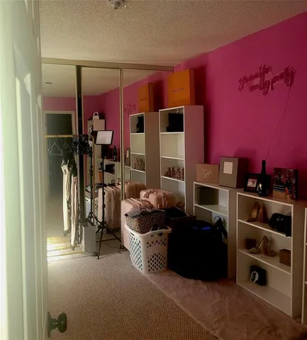 a kitchen with a refrigerator and a stove top oven