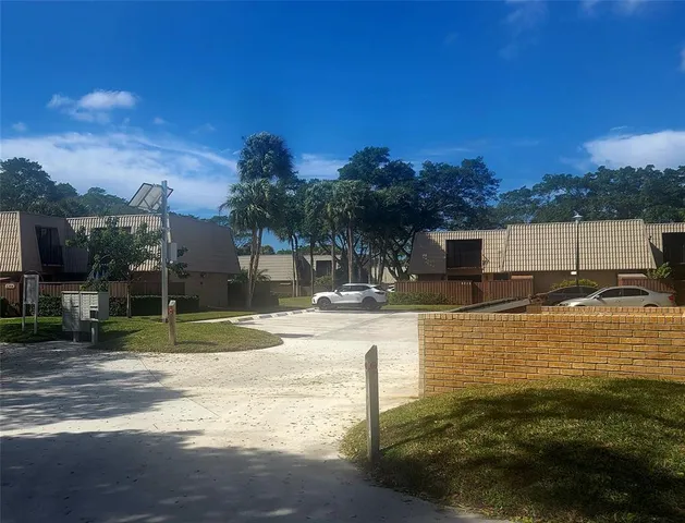 a swimming pool with outdoor seating and yard